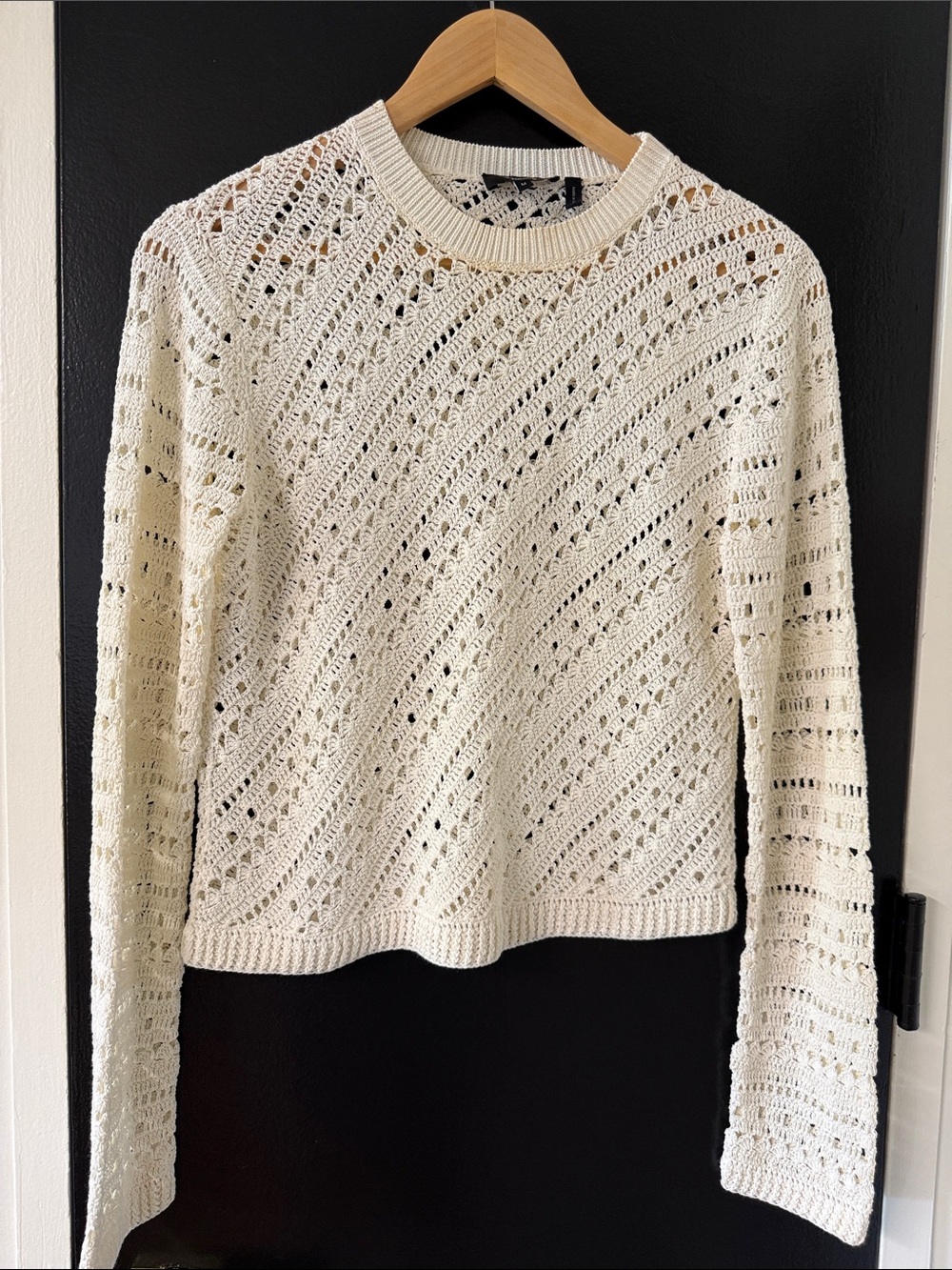 Theory Tissage crochet crewneck sweater in an ivory color.